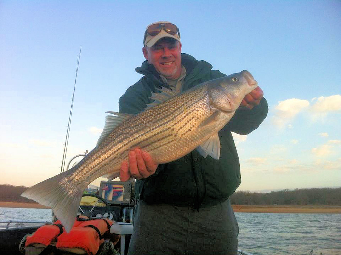 Brian Hughes striper fishing with Dan Barnett in 2014.